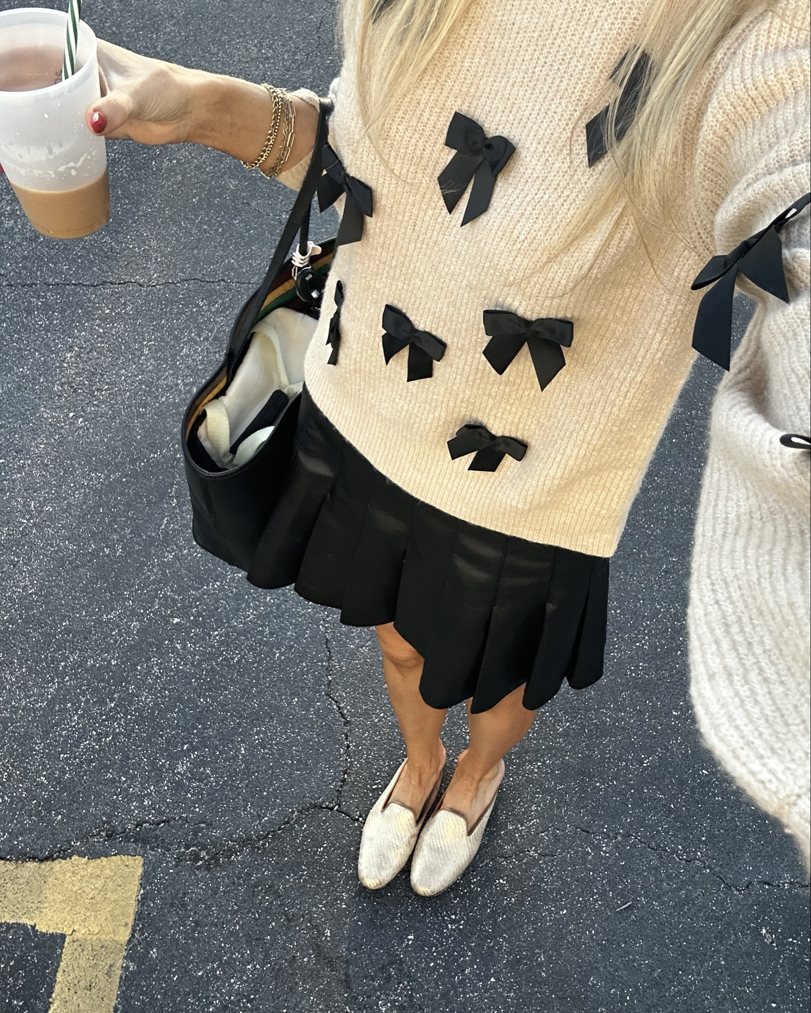 Super soft sweater with cute black blows paired with a vegan leather pleated skirt 

#LTKCyberWeek #LTKGiftGuide #LTKSeasonal