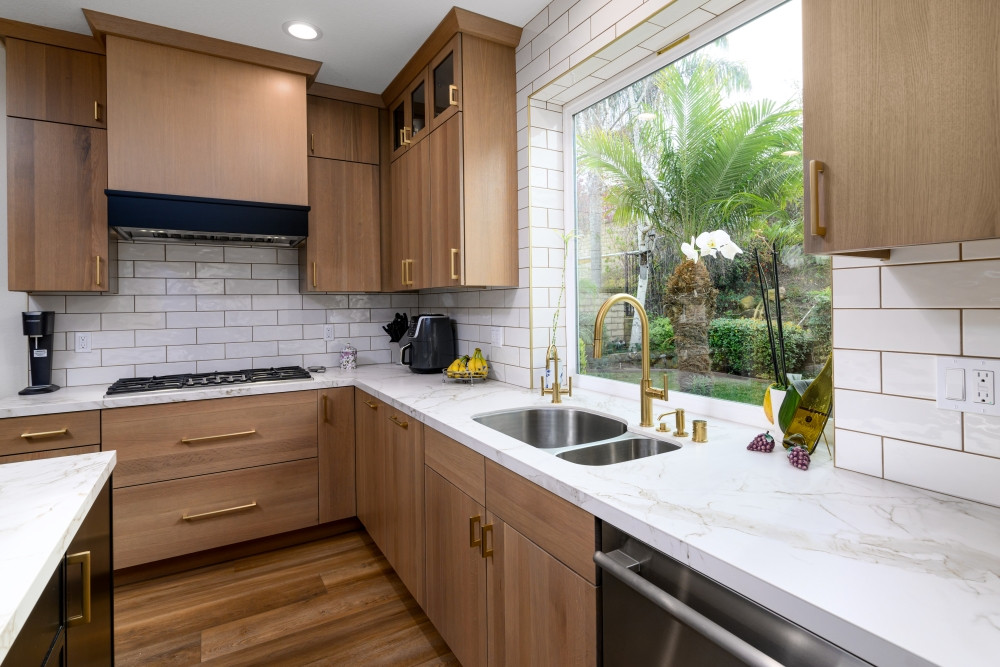 Designed, remodeled, and built by our team—this kitchen is all about light, warmth, and effortless flow. We supplied the custom white oak cabinetry, pairing it with a stunning quartz countertop and a soft white subway tile backsplash that wraps right into the window frame for a clean finish. The large picture window brings the outside in, while brushed brass plumbing fixtures add just the right amount of elegance.

From layout to finishes, every detail was tailored for beauty and function.

#KitchenRemodel #CustomCabinetry #KitchenWithAView #QuartzCountertops #WhiteOakCabinets #DesignBuildFirm #LTKHome #PinterestKitchen #KitchenInspo #ModernKitchenDesign #SubwayTileBacksplash #BrassFixtures #BrightKitchen #InteriorDesignInspo #FunctionalLuxury #TailoredInteriors 

 #LTKHome