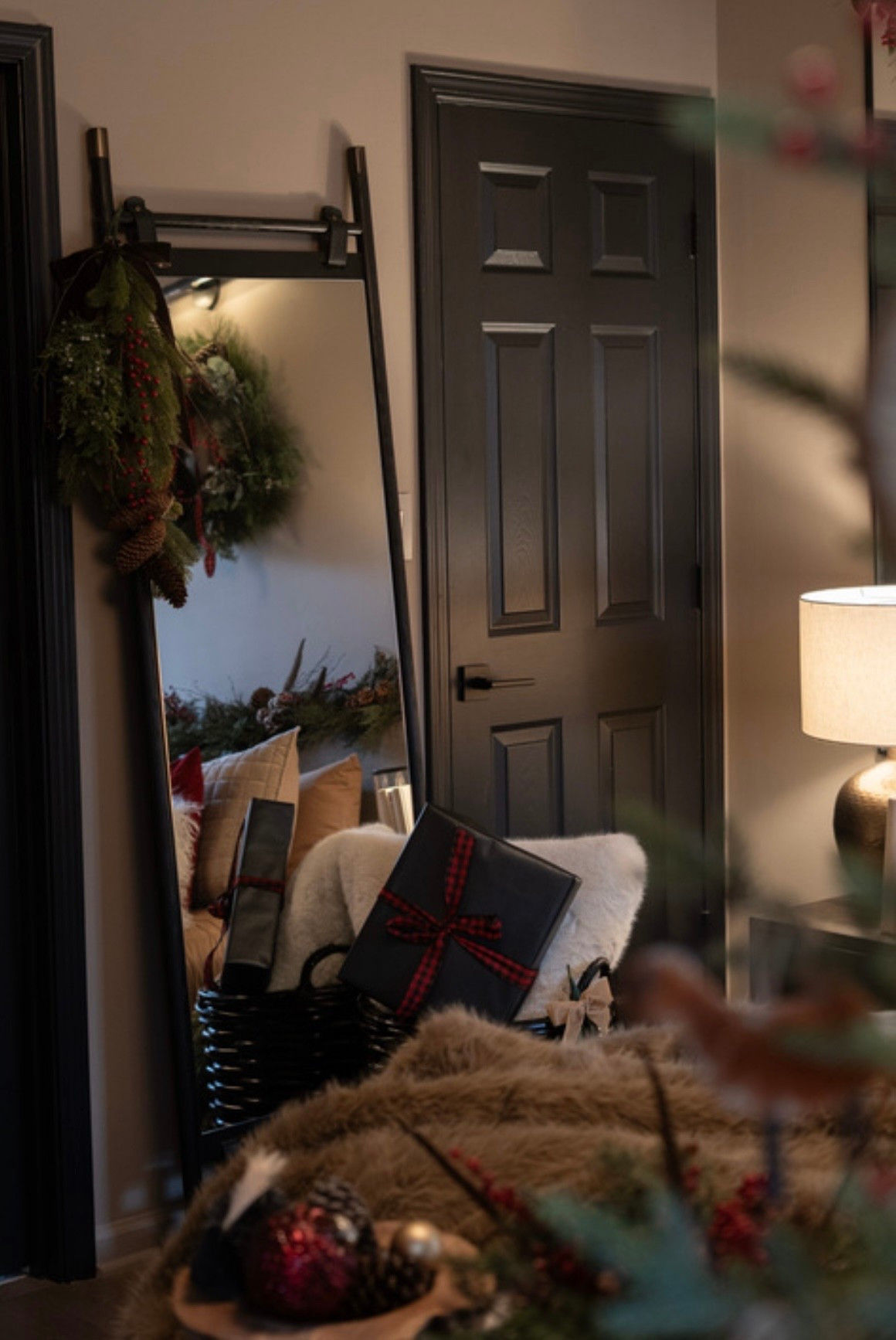 I wanted this space to feel like a true holiday sanctuary, and the mix of knit pillows, velvet accents, faux fur, and classic Christmas greenery brought it all to life. The soft glow from the lamps and the natural textures make the room feel warm, inviting, and perfectly festive. For anyone searching for cozy Christmas décor inspiration, this setup proves that small seasonal layers can completely transform a room.

#LTKSeasonal #LTKHome #LTKHoliday