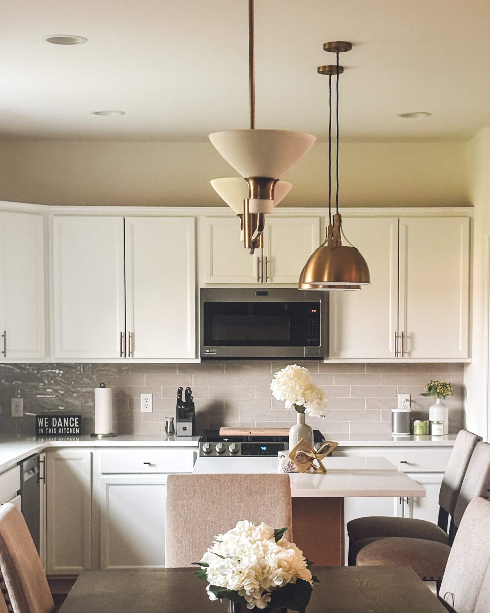 Beautiful neutral kitchen , neutral home decor, affordable brass pendants 



#LTKFindsUnder50 #LTKFindsUnder100 #LTKHome