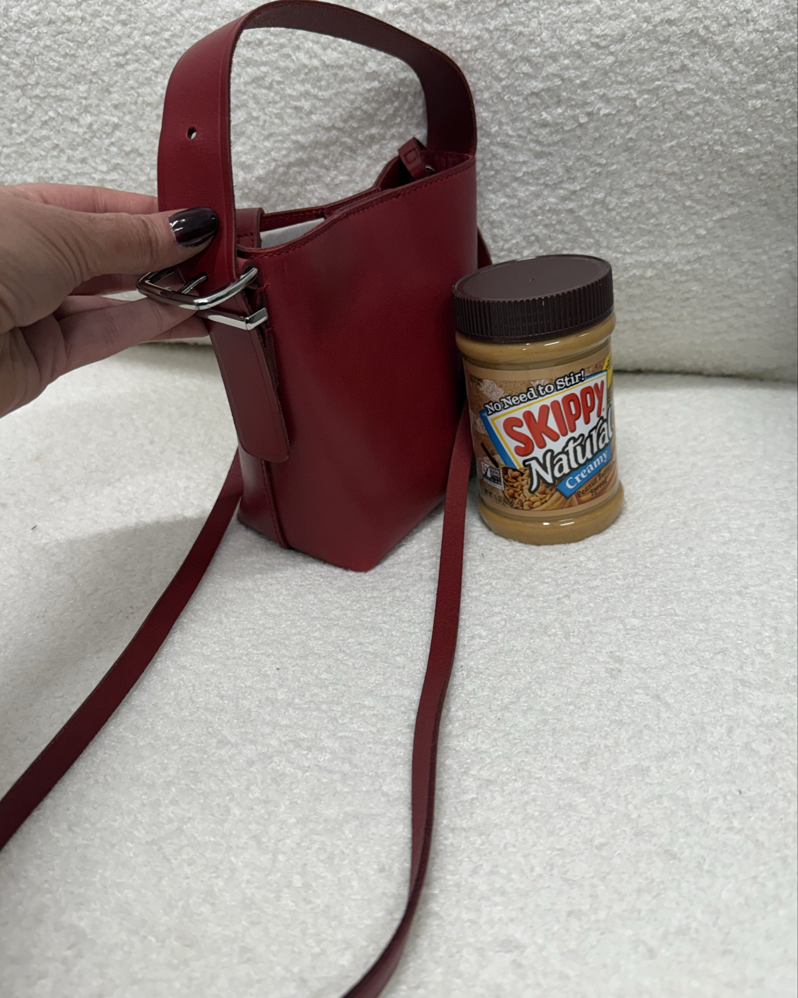I’ve been in search of a cute red bag I can use for going out or dinner that fits my phone and can be worn on the hand or crossbody and I found it at Madewell. This price is unbeatable and there are so many cute colorways. A must on sale or not. Magnet closure at top. Peanut butter for scale. 

#LTKCyberWeek #LTKGiftGuide #LTKFindsUnder50