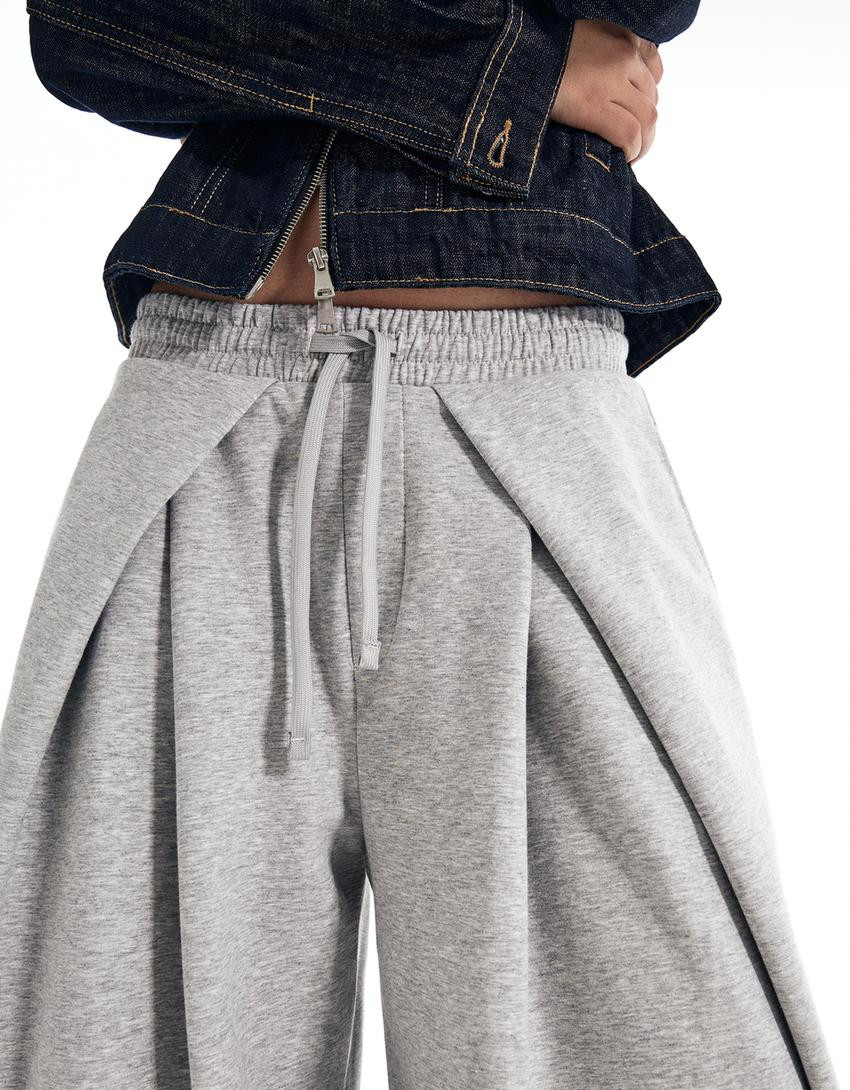 Neoprene effect wide-leg trousers with stoppers - Women | Bershka UK