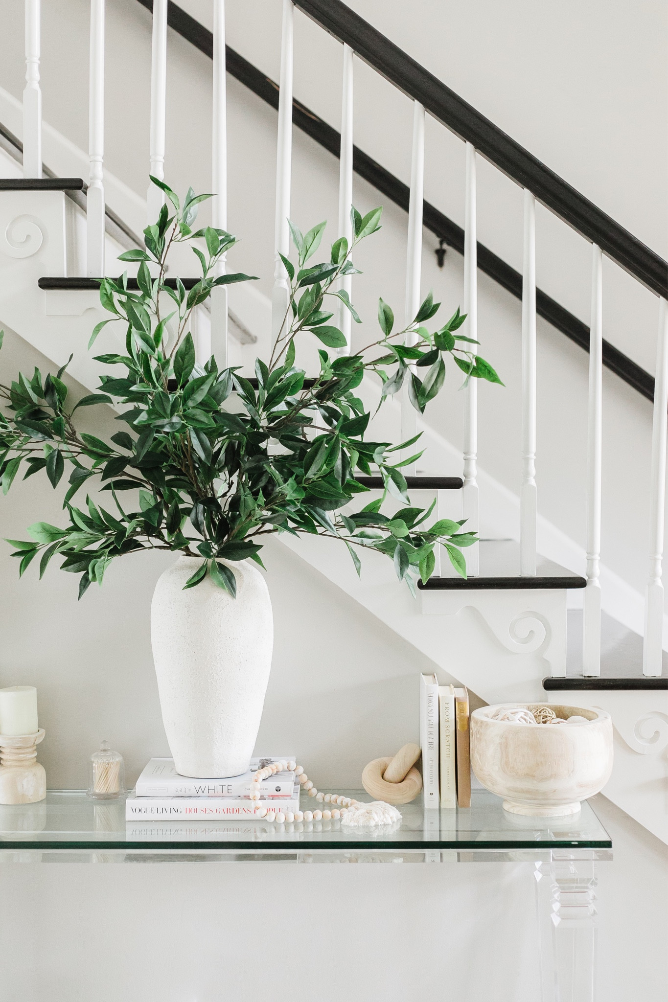 Entry Way Table Styling // Welcome guests with a touch of sophistication by styling your entryway table with elegant decor and functional pieces. From a stunning vase. Make a lasting impression and set the tone for the rest of your home. 