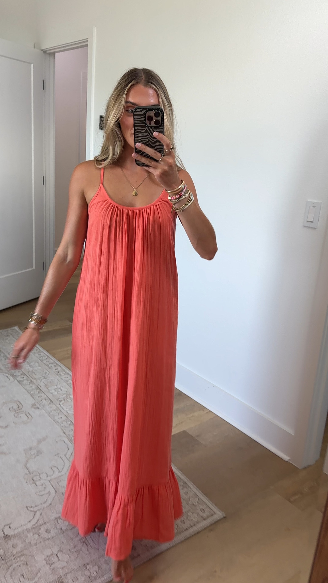 @PJ Salvage size xs Made for sunny days and warm evenings, this coral maxi dress is crafted from airy cotton double gauze with a soft, textured drape. The silhouette falls from delicate straps into a breezy, ruffled hem, finished with a beaded tie-back detail that moves easily from day into night.

#LTKootd #LTKSwim #LTKSeasonal