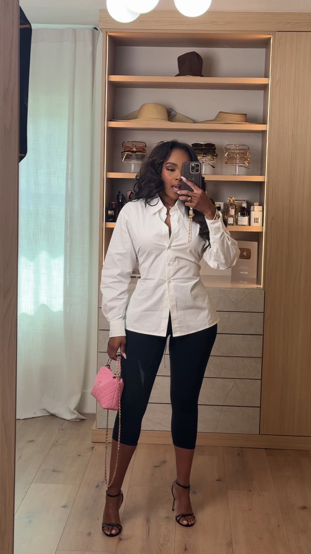 Hi babes!

This black and white look is that perfect mix of classy and trendy — the structured white button-down paired with capri leggings gives such an effortless model-off-duty vibe while still feeling polished.

Where to wear this:
Dinner plans
Girls night
Date nights
City outings

I love outfits like this because they’re built around timeless staples you can style so many different ways — so your cost per wear keeps dropping while still looking chic every time.

Everything is linked below

xx Kira | Kira’s Fashion Finds

34D - 27 - 40 | size small or 4