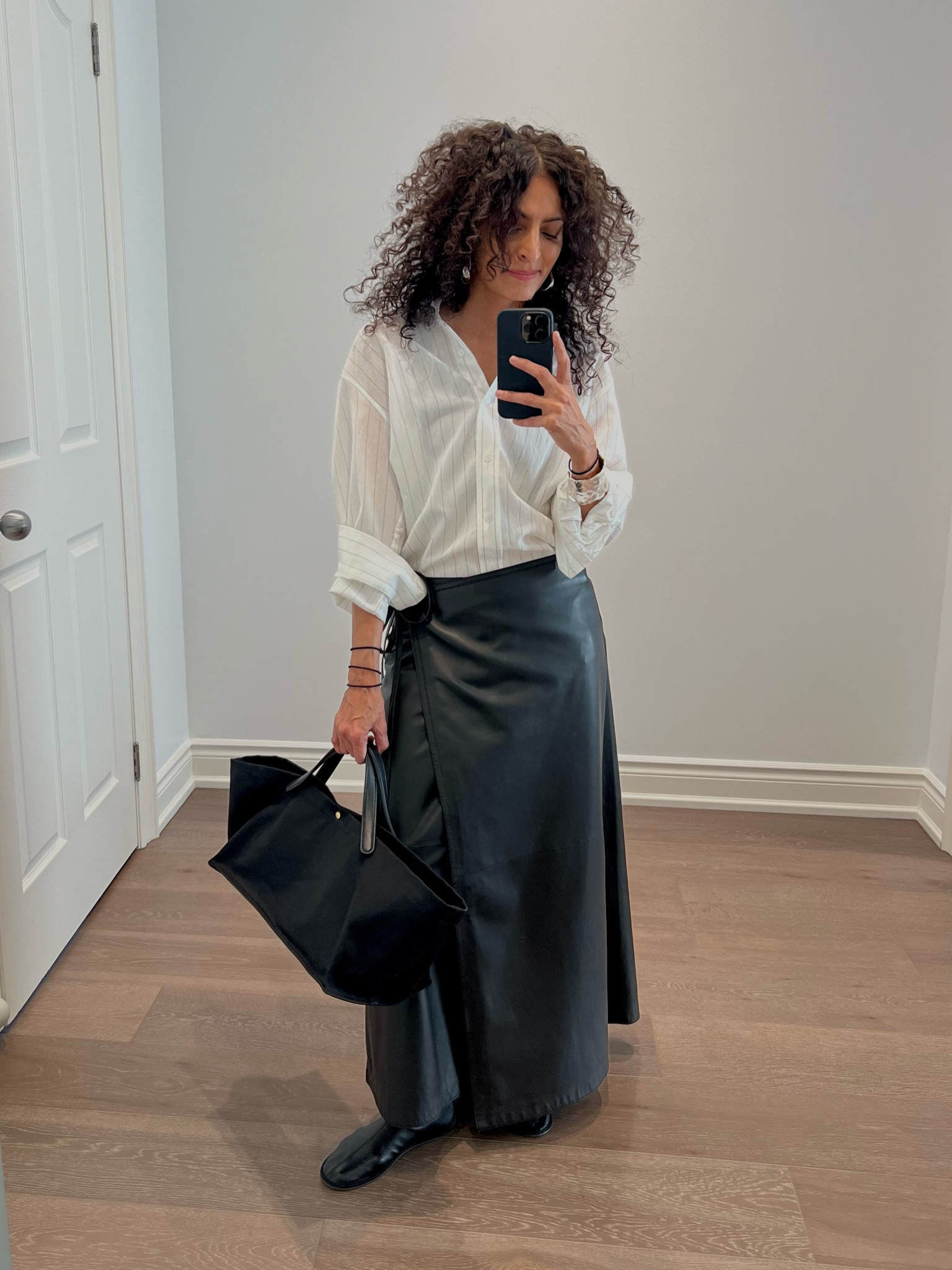 Went up to the nearest half size in the Sock boots.  Took size small in the skirt, xs in the shirt.  I’m 5’2”.  Bag is the Idaho by The Row.