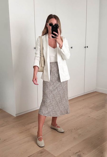 The cutest Jenni Kayne leopard slip skirt styled with a cream knit tank, leather Mary Jane flats and a white blazer.

women's fashion, women's outfit idea, outfit inspo, trending fashion, how to style a blazer, white blazer fashion, classic fashion, chic fashion

#LTKSeasonal #LTKstyletip