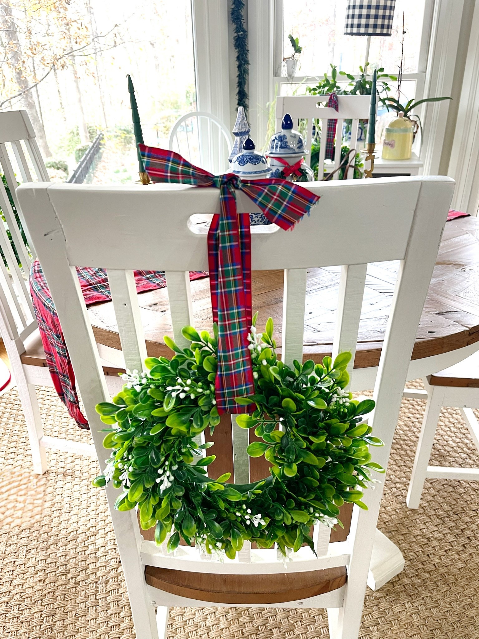 🎀 Holiday Chair Wreaths in the Breakfast Nook ✨

Adding the sweetest touch of Christmas charm to our breakfast nook with these mini boxwood wreaths tied to each chair using classic red tartan ribbon. It’s such an easy, affordable way to bring the holidays into your kitchen, and it instantly makes the whole space feel festive and pulled together. I paired the wreaths with our white dining chairs, reclaimed wood pedestal table, blue + white ginger jars, green taper candles, and pops of plaid throughout the room. Cozy, classic, and so timeless for Christmas decorating! ❤️🌿🎄

holiday kitchen decor • Christmas chair wreaths • boxwood wreath decor • plaid Christmas décor • classic tartan ribbon • breakfast nook Christmas • festive kitchen styling • holiday home ideas • Amazon holiday finds • cozy Christmas decorating • chinoiserie Christmas touches 🎄✨

#LTKHoliday #LTKFindsUnder50 #LTKHome