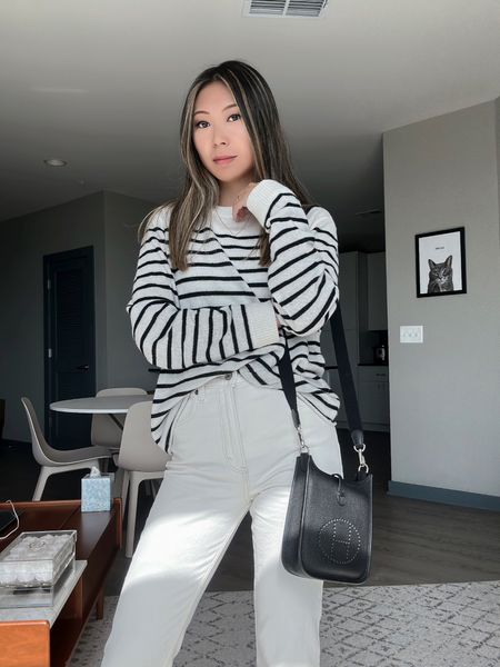 This outfit is giving me yacht vibes // sweater from reformation, bag from Hermes, jeans from Abercrombie, sneakers from Veja // striped sweater, white jeans, spring outfit, summer outfit, modest fashion, parisian style

#LTKstyletip #LTKFind #LTKSeasonal