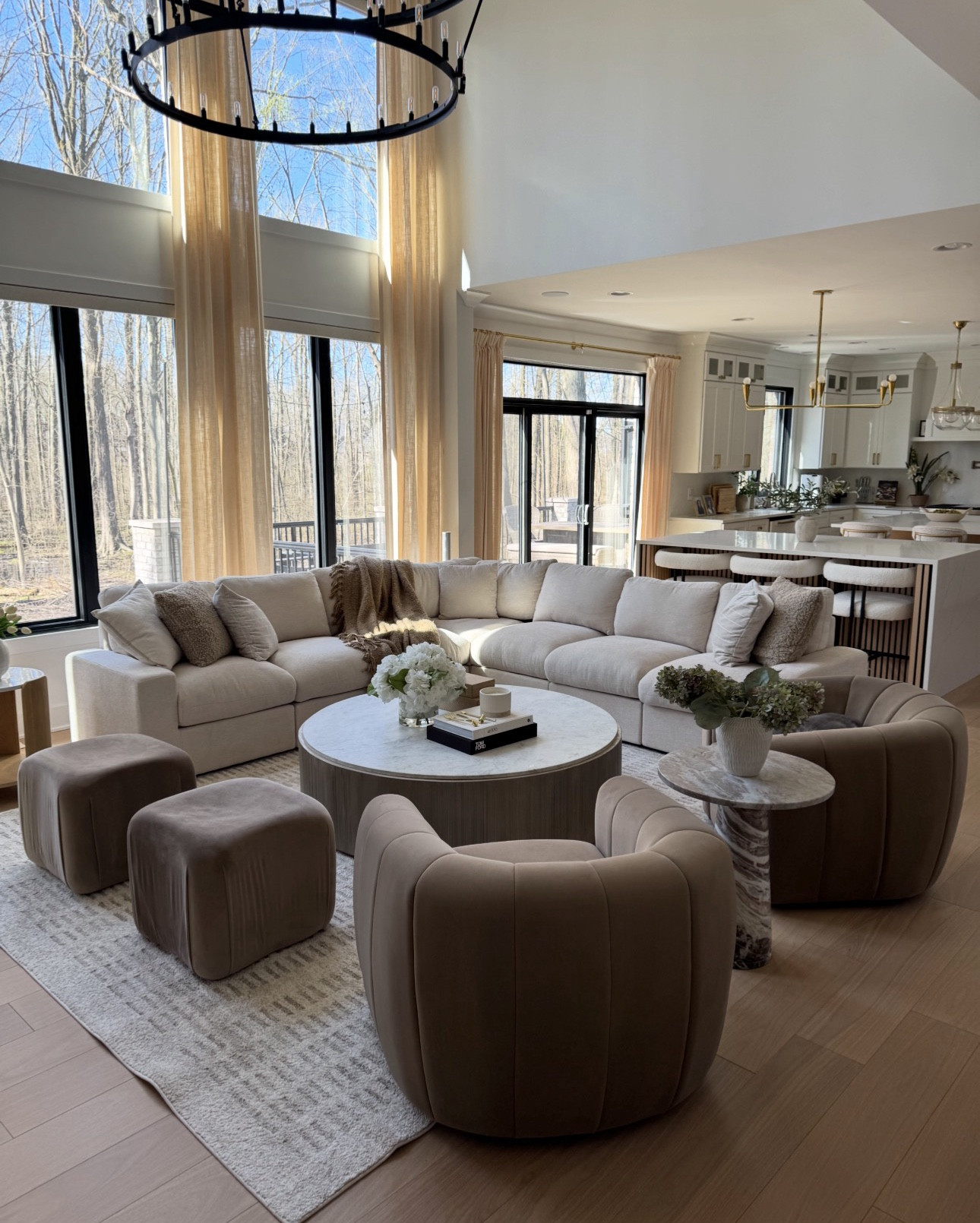 Neutral home furniture and decor. Brown velvet swivel chairs , brown velvet ottomans, textured grey rug, affordable sectional.

#LTKHome #LTKSaleAlert
