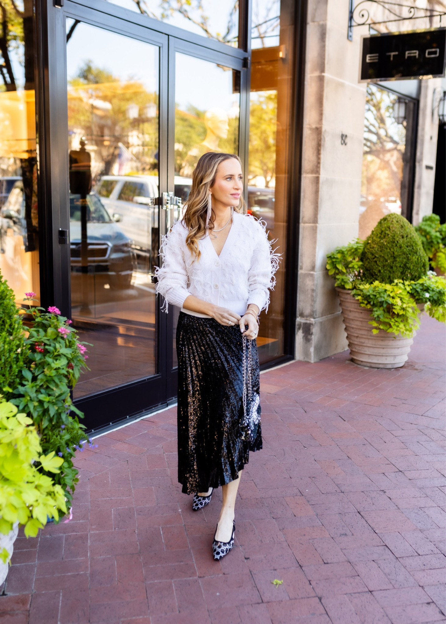 A little sparkle? Some feathers? Why not both? This outfit is perfect for a holiday party or dinner out. I love the black sequin skirt combined with this light feather cardigan. I topped it off with more sequins! I always get compliments on this mini sequin Chanel bag and I found a similar one for resale as well as a bag that’s in a similar style. These black and rhinestone shoes also perfectly topped off this holiday look. 

#holiday #holidaystyle #holidayparty #christmas #christmasparty #holidayfashion #vintage #chanel #alc #jonathansimkhai #gucci #sequin #sequins #feathers

#LTKSeasonal #LTKshoecrush #LTKHoliday