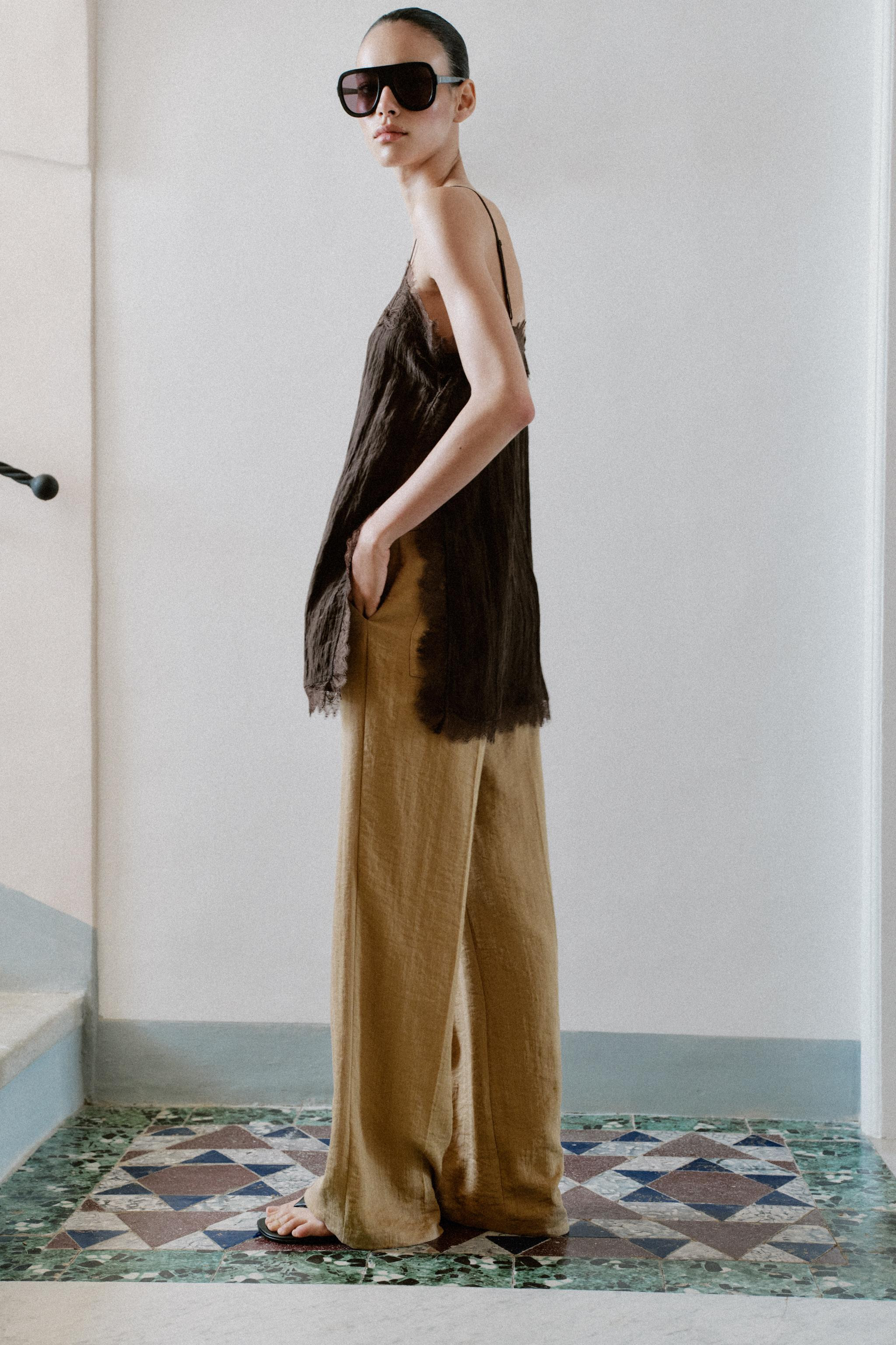 V-neck top with adjustable thin straps. Features a crinkled effect fabric and lace trim. | Zara UK