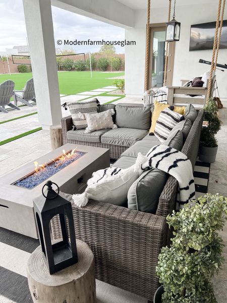 Our outdoor patio furniture set is on sale! Outdoor sectional plus table behind the sofa, two Ottomans on sale. Fire table. Propane tank is hidden under the table behind the couch. Fire pit, black and white striped outdoor rug, outdoor lantern, pottery barn, wayfair, Walmart, Better Homes & Gardens, outdoor furniture, outdoor couch, summer furniture, home decor, modernfarmhouseglam

#LTKsalealert #LTKhome #LTKSeasonal
