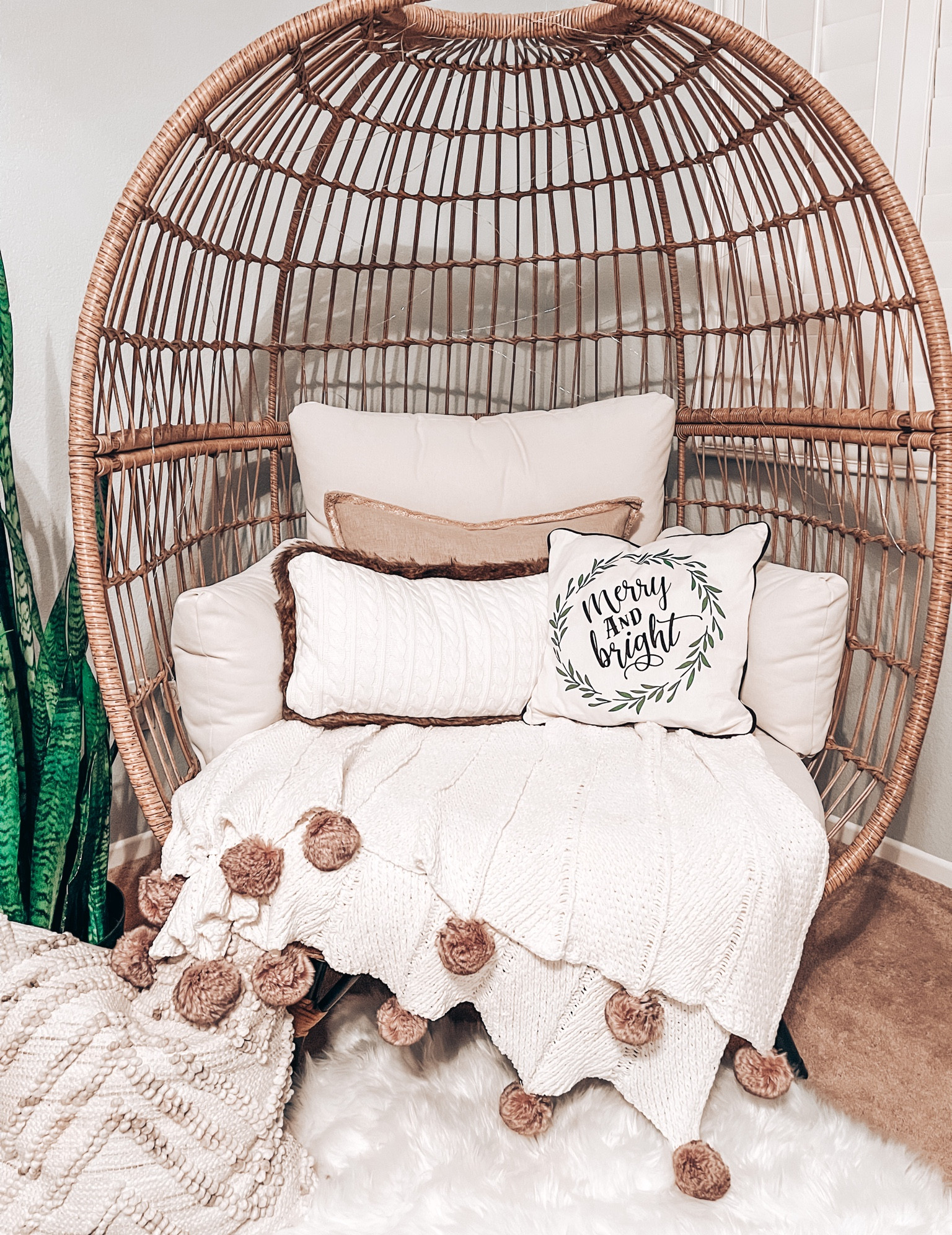 Cozy egg chair - soft blankets, pillows and a rug.

#LTKSeasonal #LTKhome #LTKHoliday