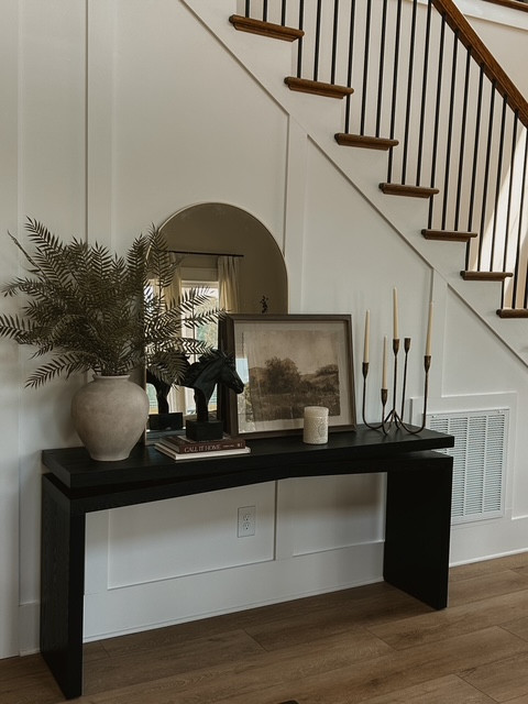 Neutral moments that still make a statement. Layered textures, warm woods, and a little mood with a black console… this wall came together so effortlessly. Everything linked for that modern organic look that feels styled but lived in.

#ltkhome #modernorganic #cozystyling 

 