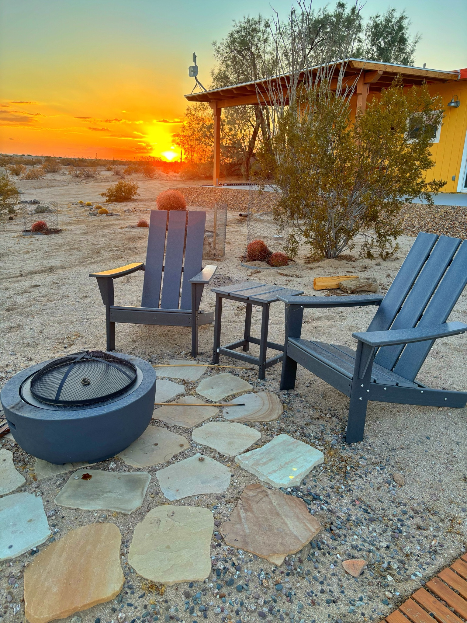 Durable outdoor Adirondack chairs for our fire pit set up in the desert.  These are from Walmart.  