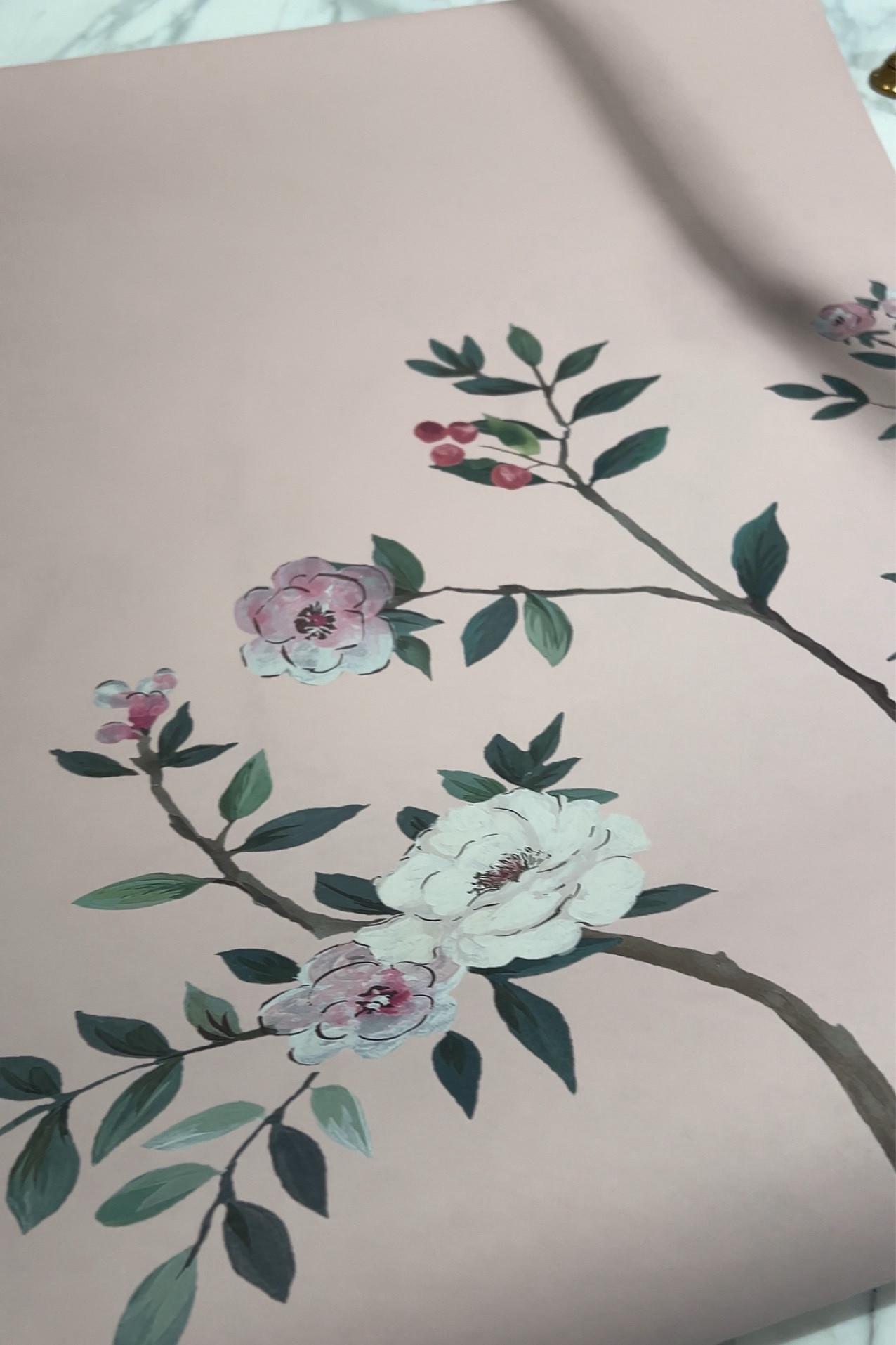 This pretty chinoiserie wallpaper adds  life and color to any wall. 