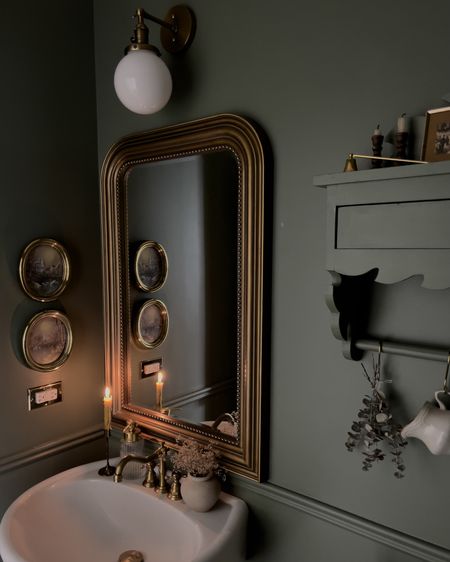 Green and gold powder room. 

Gold mirror, milk glass vanity light, oval frame prints, faucet, gold outlet cover 

#LTKhome #LTKFind