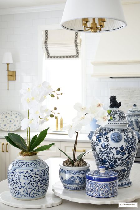 Gorgeous blue and white chinoiserie and elegant orchids are a simple and classic spring look! Home decor, kitchen decor, spring decor, ginger jars, salt mill, pepper mill, wall sconce, brass lighting, pendant light 

#LTKSeasonal #LTKFind #LTKhome