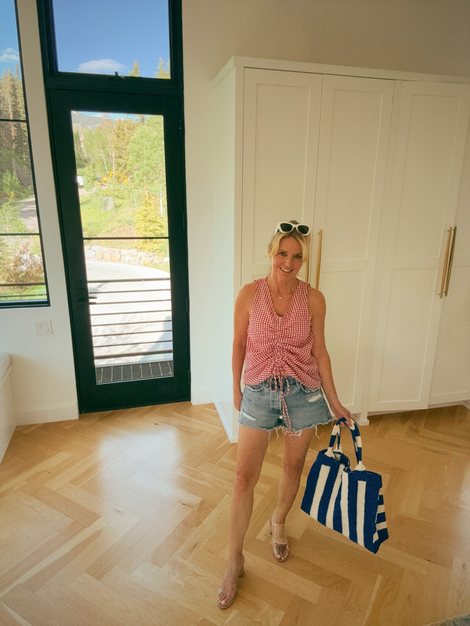 A ruched front top is one of the smartest styling tricks out there. 

It pulls fabric toward the center and creates waist definition without any effort on your part. This Le Bop red gingham version with Moussy Vintage distressed denim cutoffs and nude heeled sandals is the summer outfit formula that just works!

#LTKgrwm #LTKootd #LTKOver40