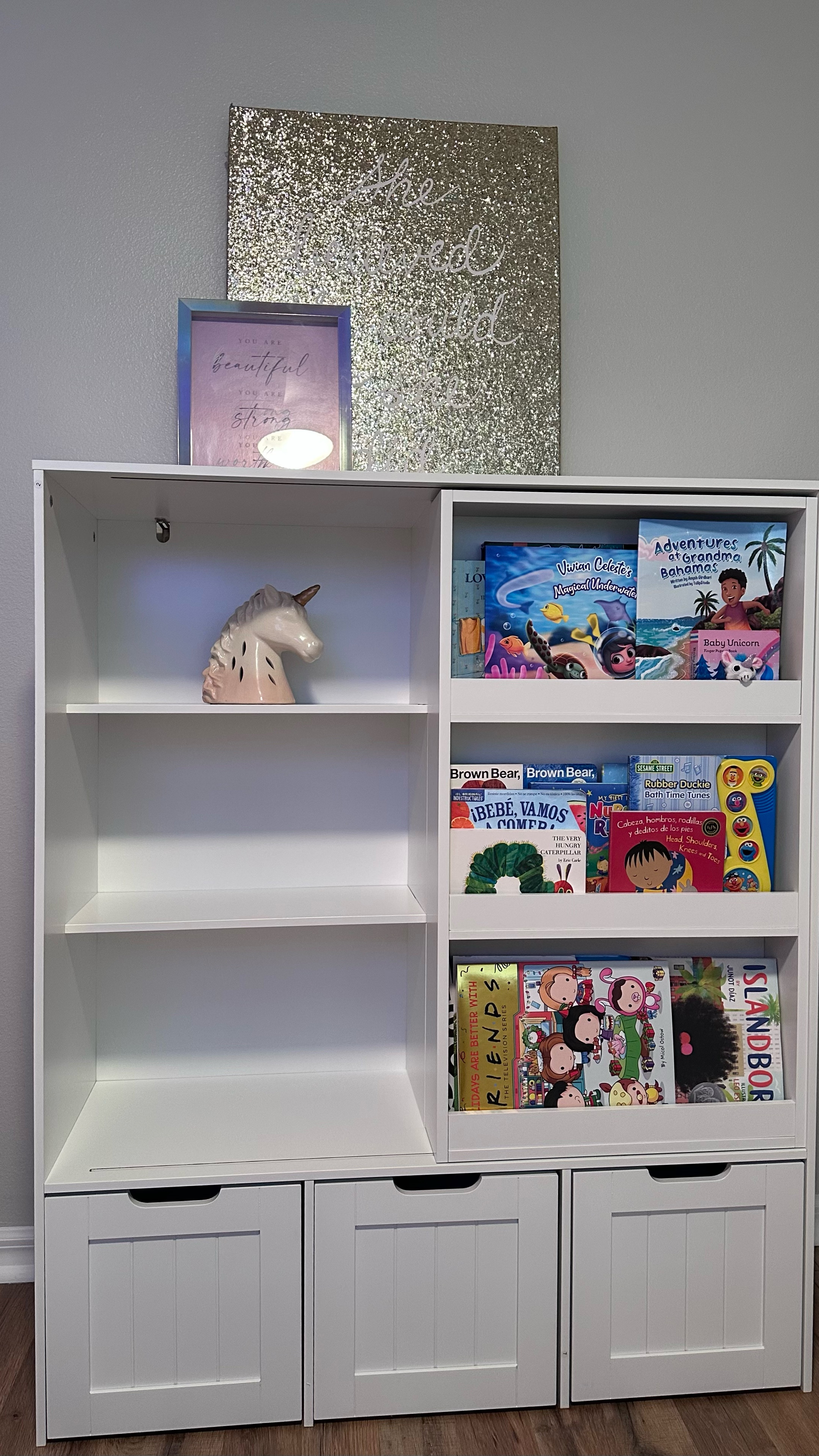 Baby bookcase with sliding bookshelf & cubbies on bottom for storage 😍✨ I can’t wait to style these shelves and add all her books. And the drawers in the bottom roll out for easy access. 

P.S. White is sold out atm, the pink and grey options are the exact shelves, just another color. I added more options too 🥰

#LTKKids #LTKBaby #LTKHome