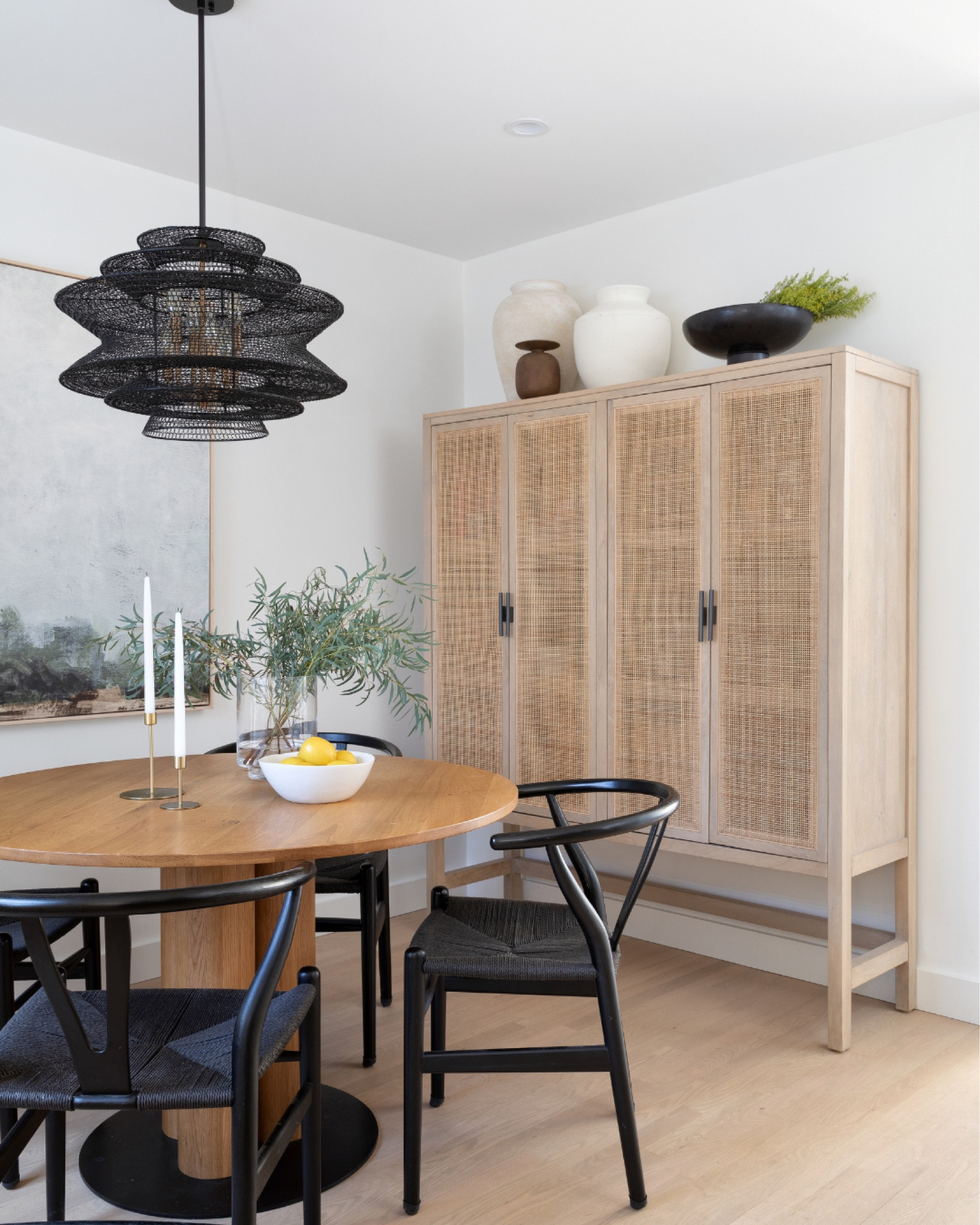 Scandinavian dining room inspiration. White oak dining table, wishbone chairs, tall cabinet. 

#LTKhome #LTKunder50 #LTKFind