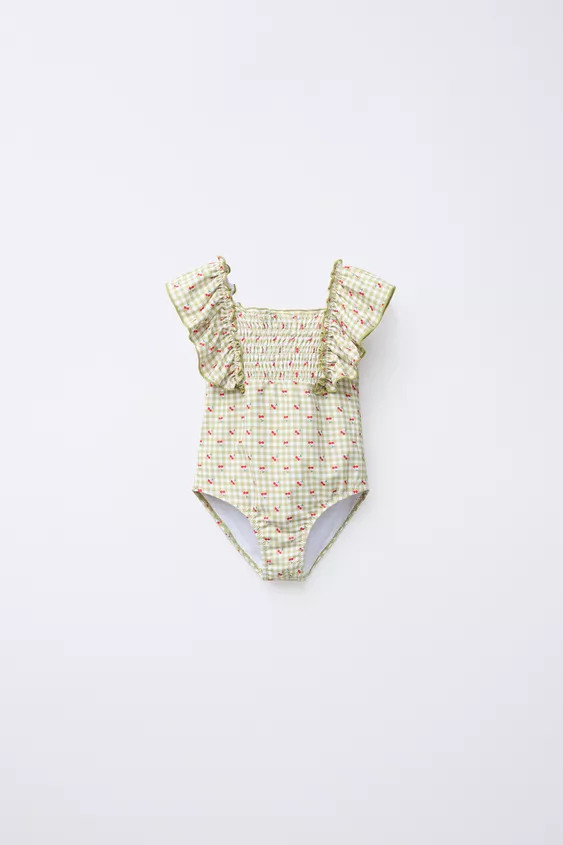 Straight neck swimsuit with ruffle straps. Smocked detail on front and back. Gingham and cherry p... | Zara US