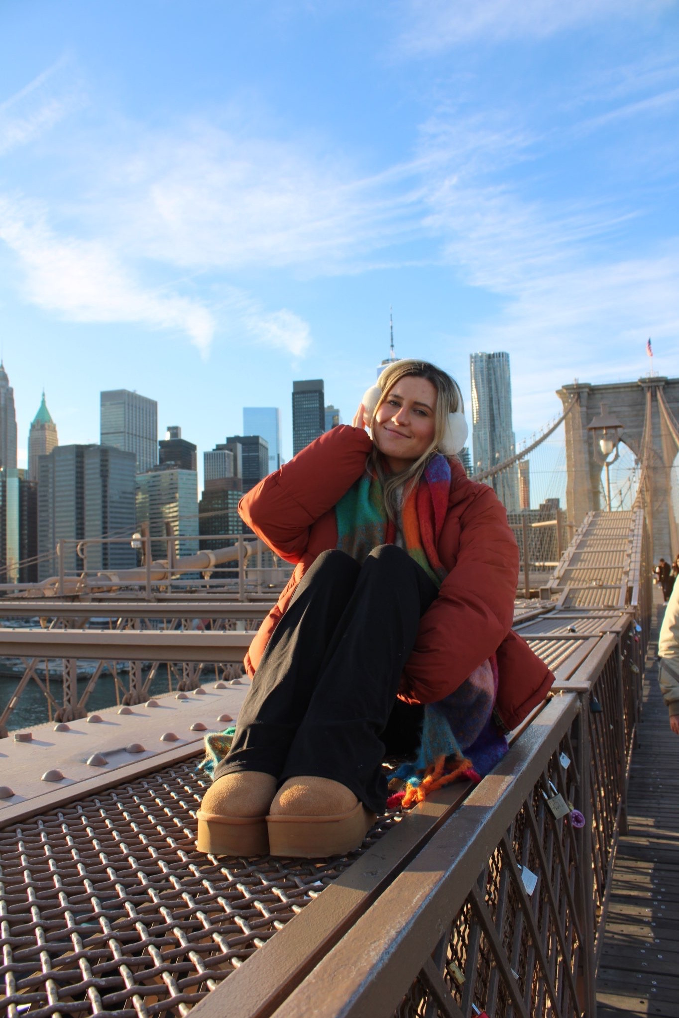 brooklyn bridge post - rust/copper puff coat jacket, plaid colored scarf, black flare pant leggings, white fuzzy ear muffs & ugg platform minis

#LTKSeasonal #LTKtravel #LTKU