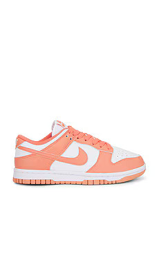 Nike Dunk Low Sneaker in White & Light Wild Mango from Revolve.com | Revolve Clothing (Global)