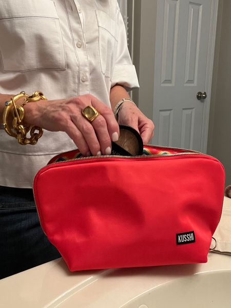 Kusshi makeup bag. Machine washable 
Removable compartment for brushes, lipstick, mascara, etc….Would also be great for inside a diaper bag or pool/beach  bag 