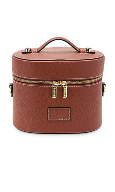 ETOILE COLLECTIVE Oval Toiletry Case in Ginger Brown from Revolve.com | Revolve Clothing (Global)