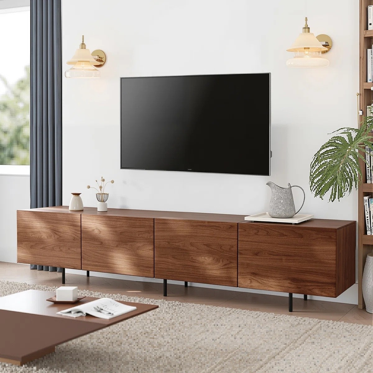 This modern walnut TV stand from Wayfair is currently 23% off and brings clean lines, hidden storage, and timeless style to any living room. The extra-long design is perfect for large TVs, while the rich walnut finish and sleek black metal legs create a warm modern look. Ideal for media storage, gaming consoles, and keeping your entertainment space clutter-free.