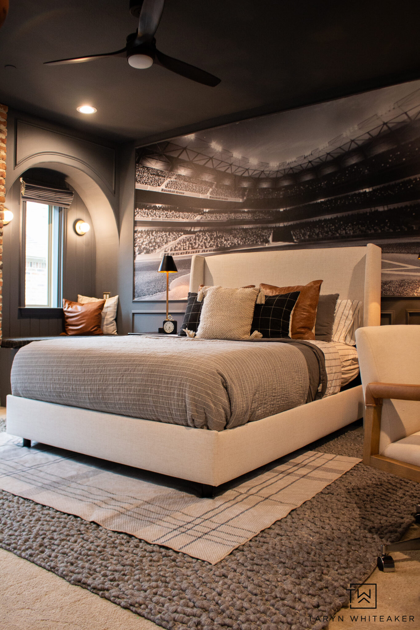 A bedroom made for the sports fan 🏈🏀⚾️ The oversized stadium mural completely makes this space, and I love how the warm neutrals keep it feeling cozy and elevated. Such a fun way to do a sports-themed room without it feeling overly themed! #sportsbedroom #boysbedroom #bedroominspo #kidsroomdecor #homedecor

#LTKSeasonal #LTKHome