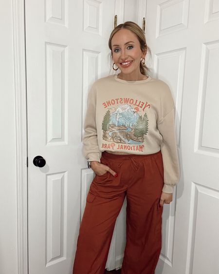 Comfy work from home outfit on a Friday. 
.
.
.
#graphicsweatshirt #widelegpants #comfyoutfits #wfhoutfits #midsize 

#LTKmidsize