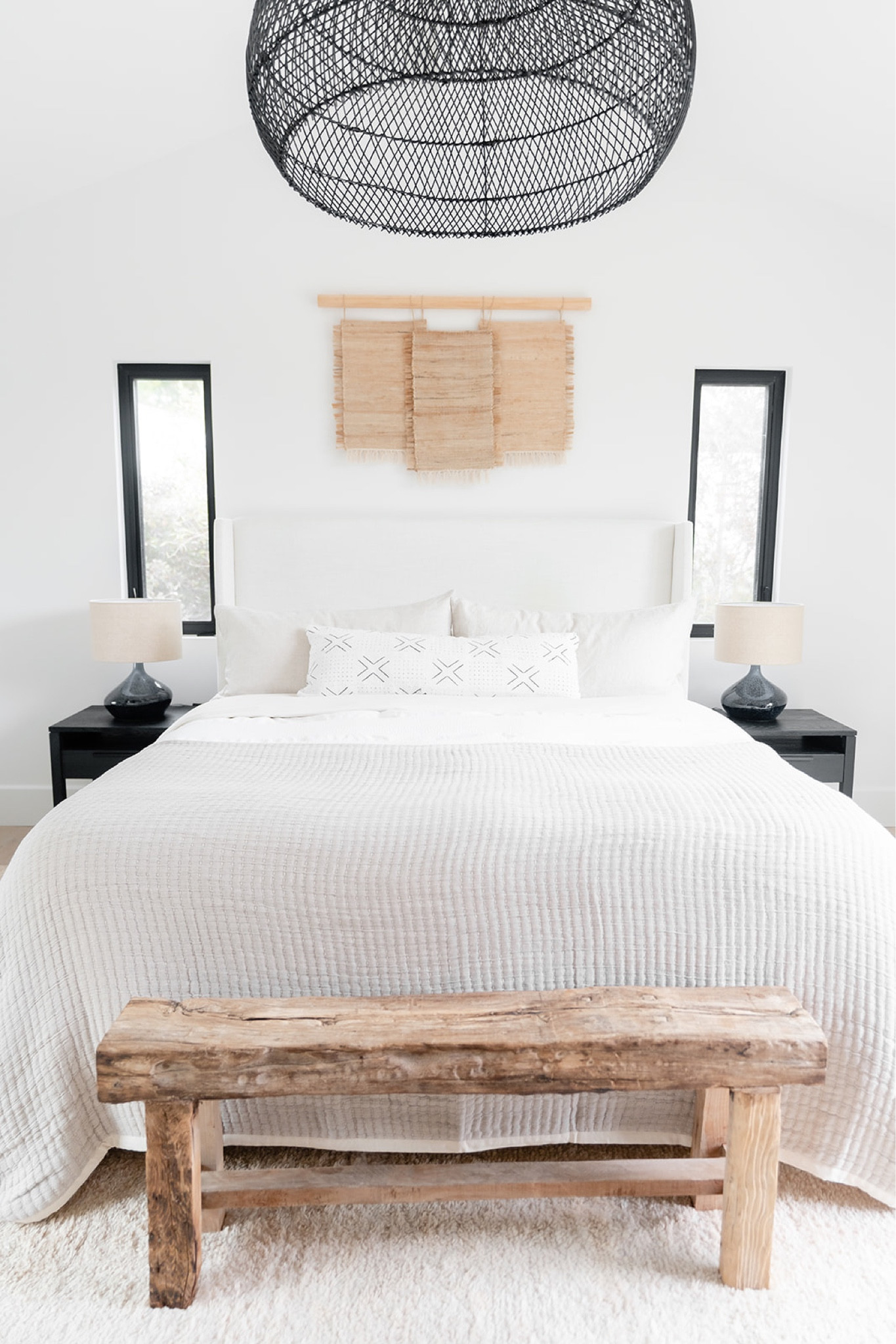 Tranquil primary bedroom 

Lulu and Georgia upholstered bed in linen and large area rug, Crate & Barrel side tables in black teak, large handwoven rattan pendant in black, vintage inspired bench, and West Elm ceramic table lamps. 

Home decor, interior design, home finds. 

#LTKstyletip #LTKhome #LTKFind