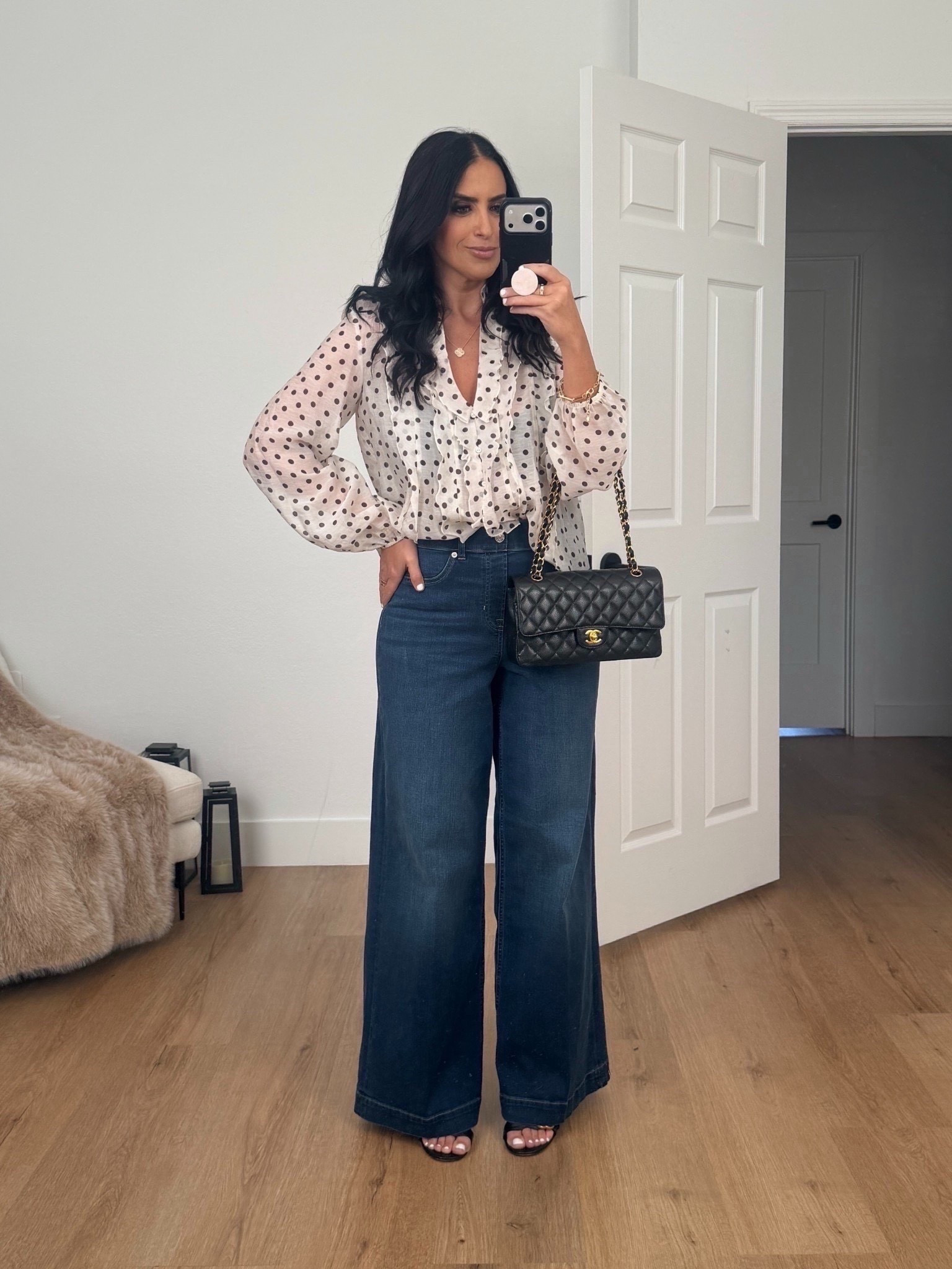 Zara ruffled polka dot blouse wearing size small. Spanxshape Everywear Wide Leg Jeans wearing size medium. 

