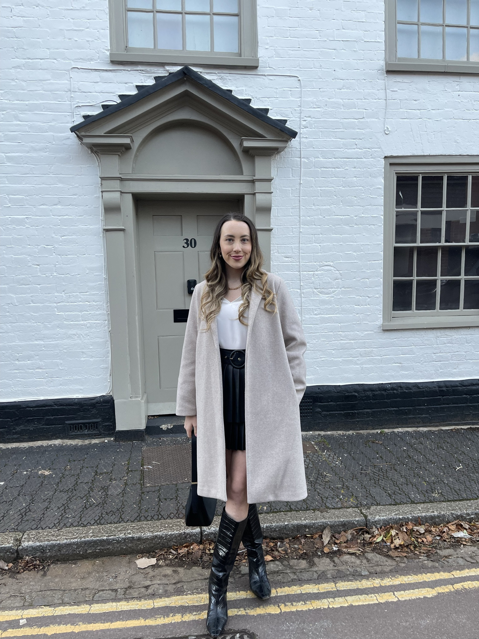 Mini skirts, knee high boots and oversized coats are my fave winter combo 🫶🏼🖤 

#LTKfindsunder100 #LTKSeasonal #LTKeurope