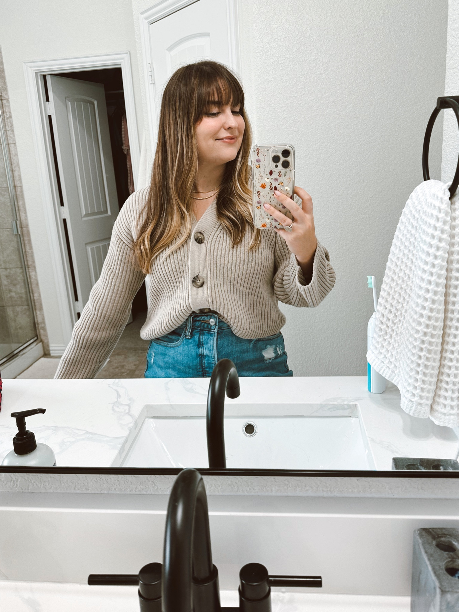 I love this cardigan so much! I wear it as a top or opened over a tank! Definitely size down. It runs big.