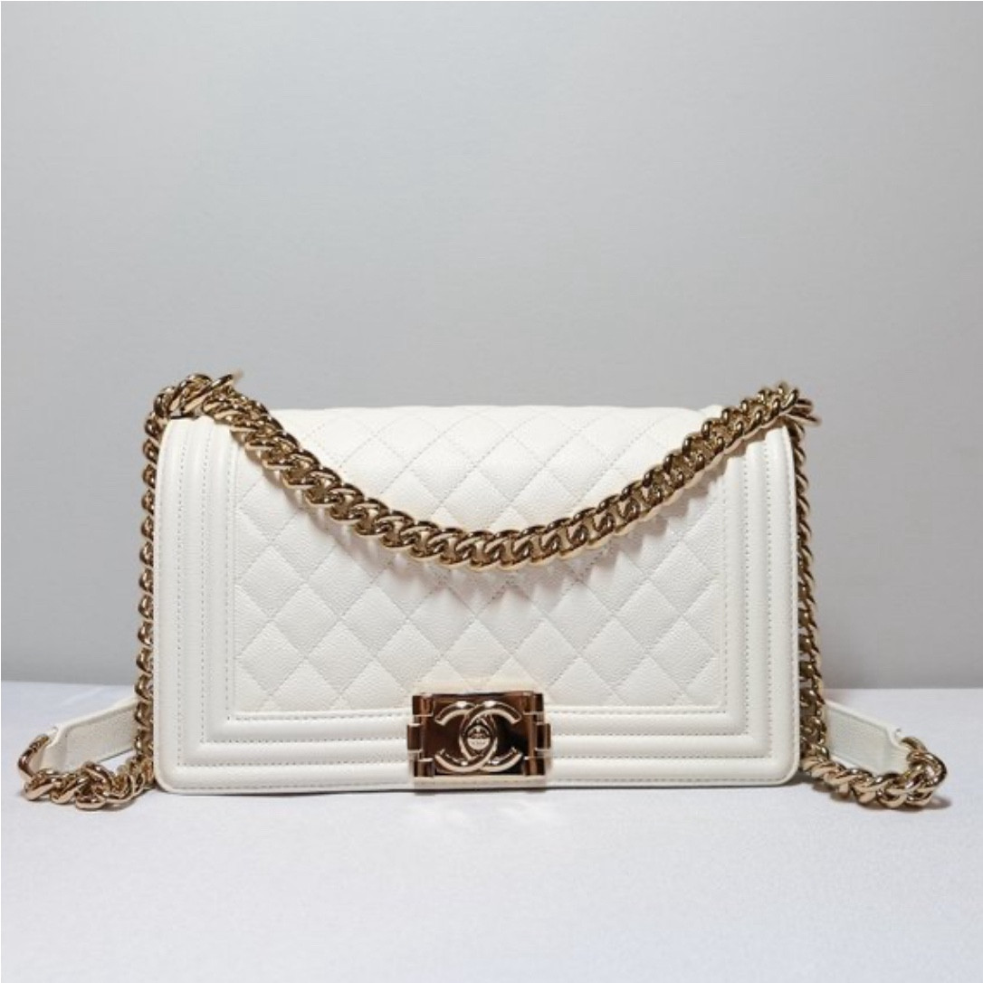 White Chanel boy bag with champagne gold hardware. 

#LTKSummerSales #LTKItBag #LTKTravel