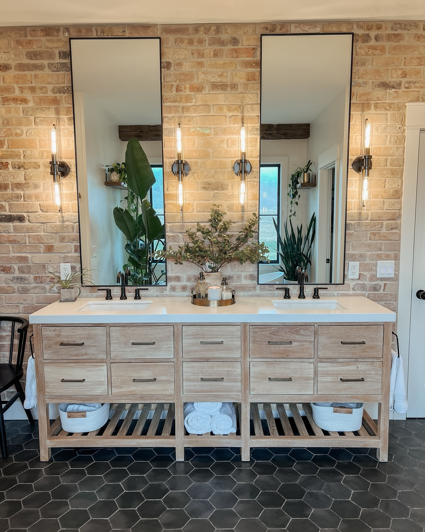 Slowing it down with some stills of the bathroom today, by request! 

This space is key for everyday living, and we wanted it to feel industrial, modern, rustic and feel like a spa all at the same time. My husband built the brick wall behind the mirrors. Then I added all the plants to make taking a bath feel like a jungle experience 😂



#modernbathroom #moderndesign #rustichome #masterbath #spaathome #masterbathroom #mastershower #rainshower #soakingtub #jungleplants #brickwall #bathroominspo #luxurybathroom #bathroomdesign #homedecor #homedesign

#LTKHome
