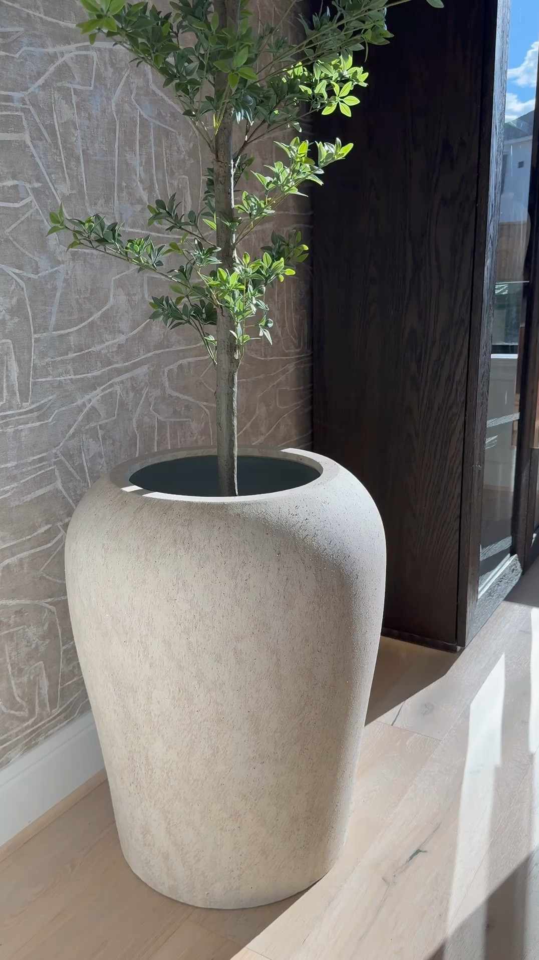I am absolutely loving this planter from Pottery Barn! It's gorgeous, and the best part is that it's so versatile - it works perfectly for both bigger trees and smaller ones too! 🌳 I love it so much that I actually ended up buying another one, haha! 😆 It's definitely a game-changer for decorating any space. 

#LTKHome #LTKStyleTip #LTKSaleAlert