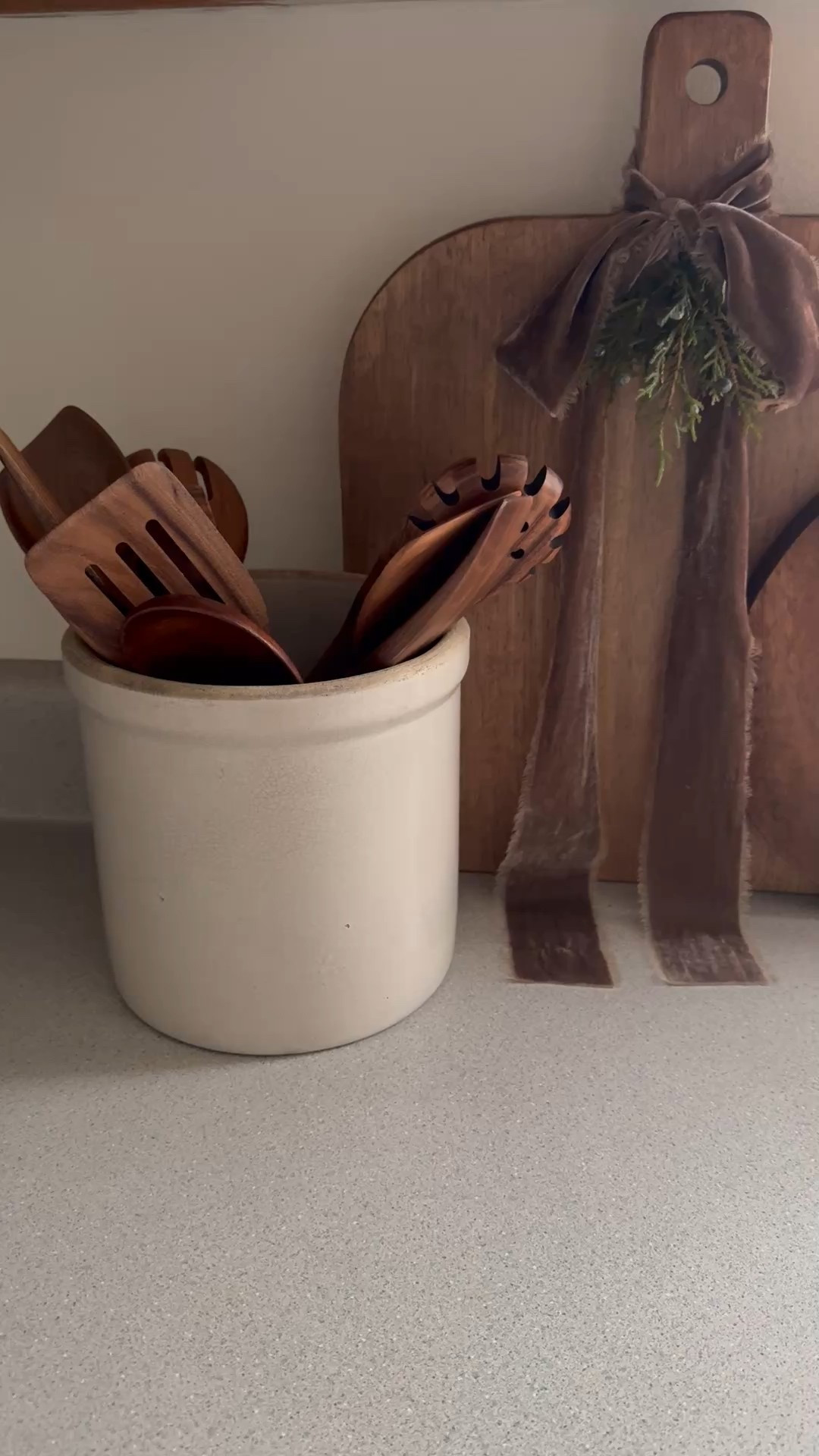 Brown velvet ribbon, crock, wood utensils, round bread board, cutting board

#LTKHome #LTKHoliday #LTKSaleAlert