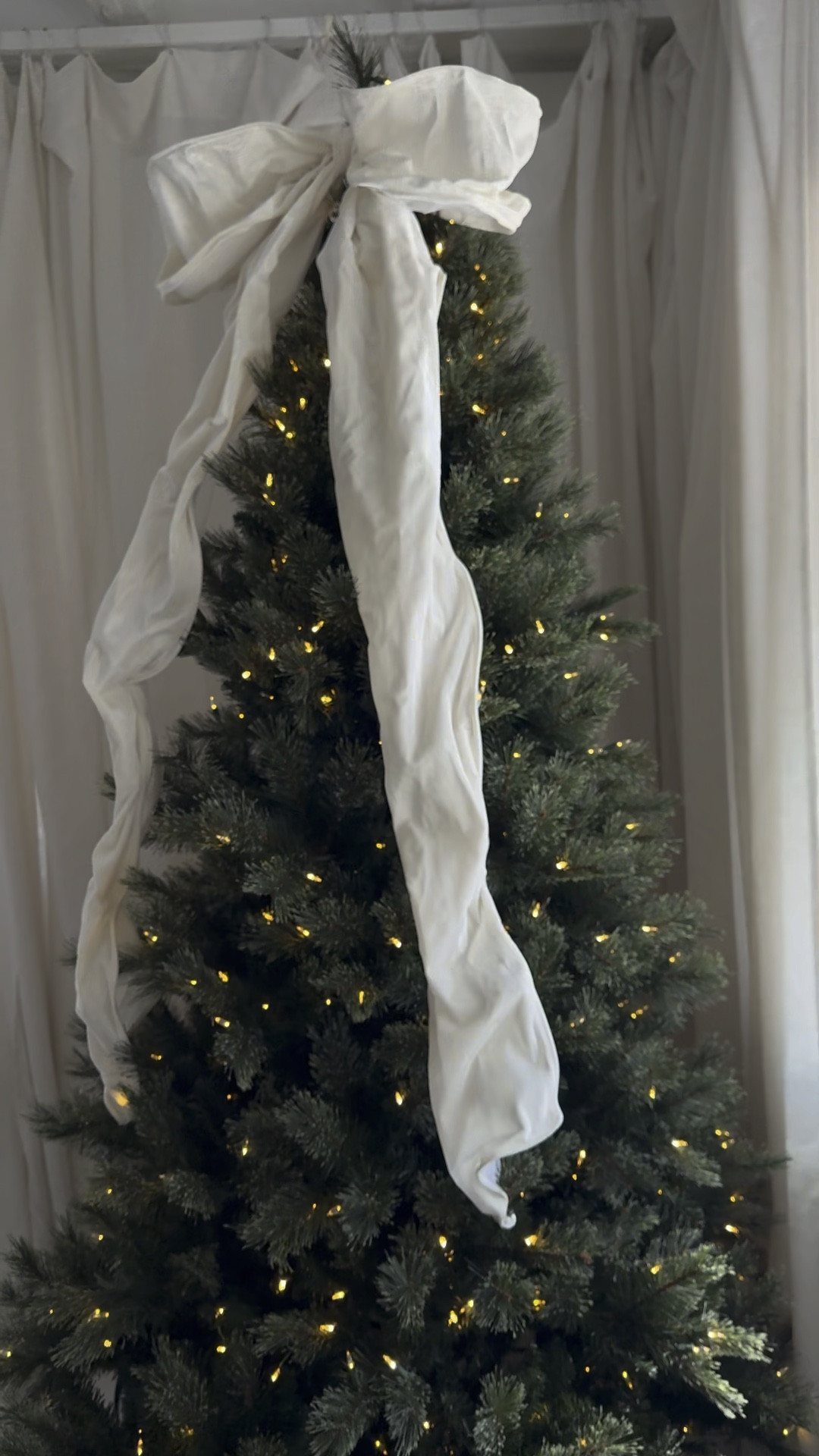 Christmas decor: Christmas tree, large bow ornament, sofa, accent chair, paper Christmas tree decor, Christmas stocking marble holders, wooden mirror - holiday decor 

#LTKHoliday #LTKHome #LTKVideo