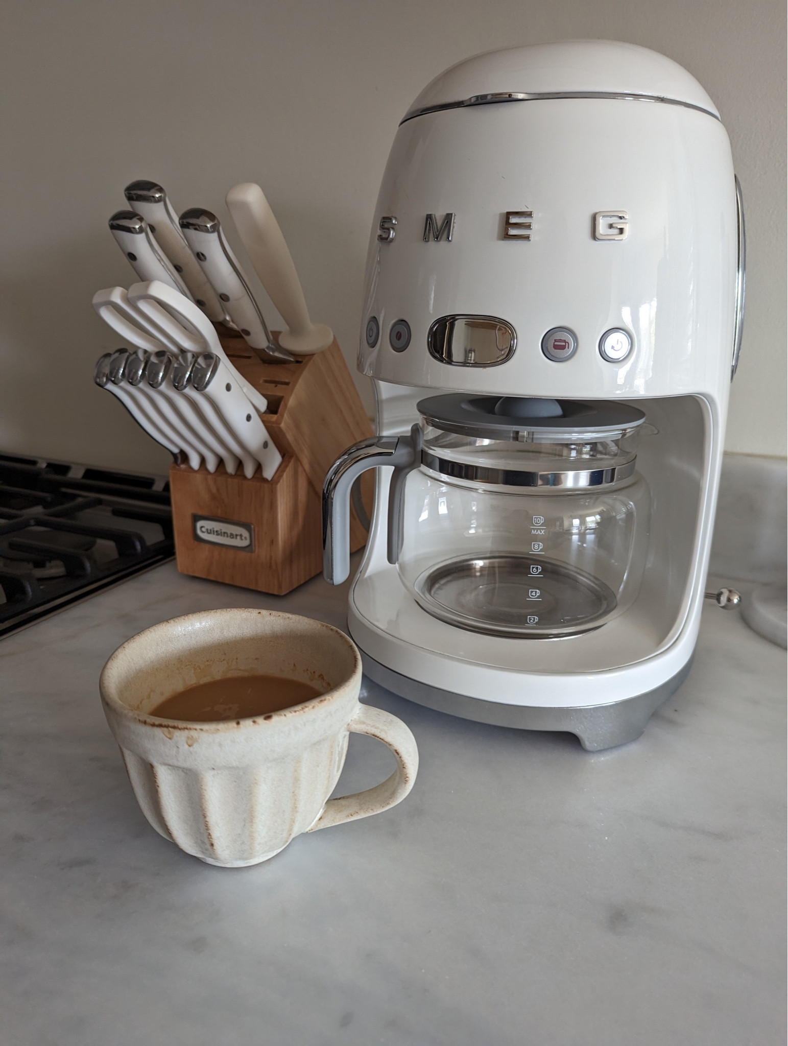 This 50s retro coffee maker is the perfect addition to your coffee essentials. It is a 10 cup drip coffee maker that has features like auto start and aroma control. You can then serve your coffee in the cutest Pottery Barn mug. 

#LTKGiftGuide #LTKFind #LTKhome