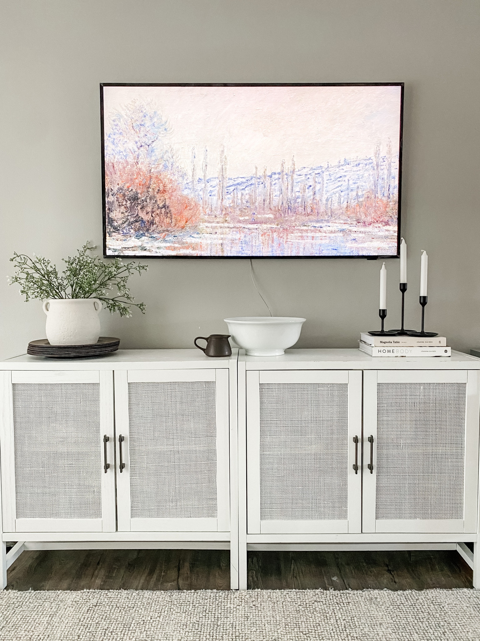 Living room console table under tv cabinets styling 
Samsung frame tv art
Neutral earthy home decor 
White cane cabinets 


#LTKSale #LTKhome #LTKFind