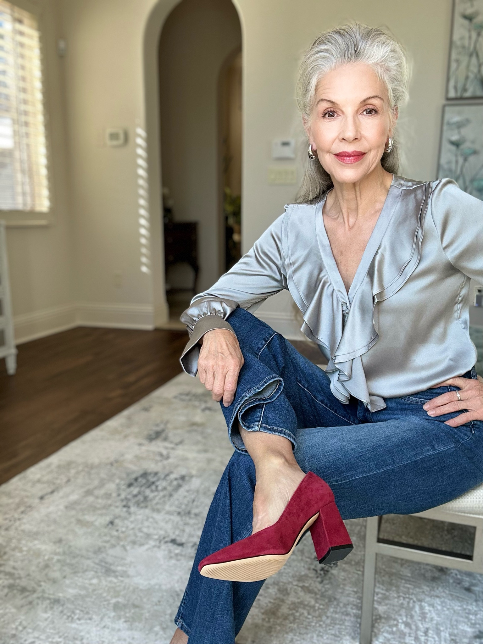 Smart casual is my favorite… it can be worn anywhere!  These High Rise wide leg jeans are soft with a perfect fit… they are fitted in the hip area making the wide leg more suited for my short legs… no pleats here… flat front…I paired them with this super feminine ruffled ( faux silk/satin) blouse ( comes in other colors ) to dress them up a bit….tied the whole outfit together with these fabulous cranberry/red suede shoes 👠!  The earrings are on trend this season at a fraction of the ( designer ) cost! Perfect Fall pieces to add to your closet!! 
For reference: 
5’6” 123 lbs 
Wearing a small blouse
Wearing a size 2 jeans 

#LTKstyletip #LTKover40 #LTKworkwear