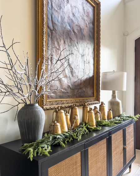 Christmas bells, gold hanging bells, gold bells, winter branches, black sideboard 

#LTKhome #LTKHoliday #LTKSeasonal