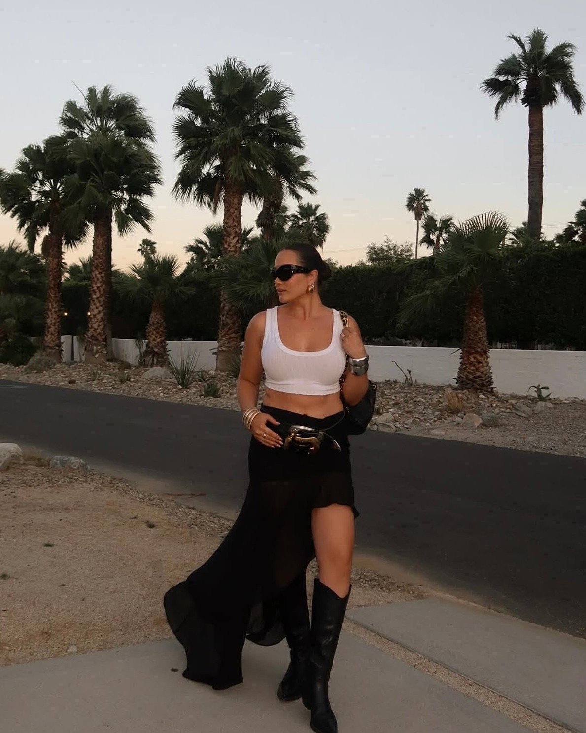 Black skirt festival outfit for Coachella/Stagecoach styled with chunky belts and bangles 

#LTKFestival #LTKootd #LTKSeasonal