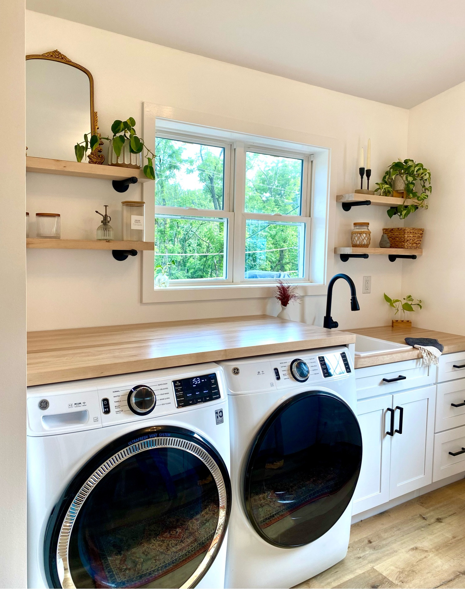 All my laundry room dreams are coming true.✨🥹 
laundry room | open shelves | butcher block | plants | shelf decor | gold mirror 

#LTKFind #LTKhome