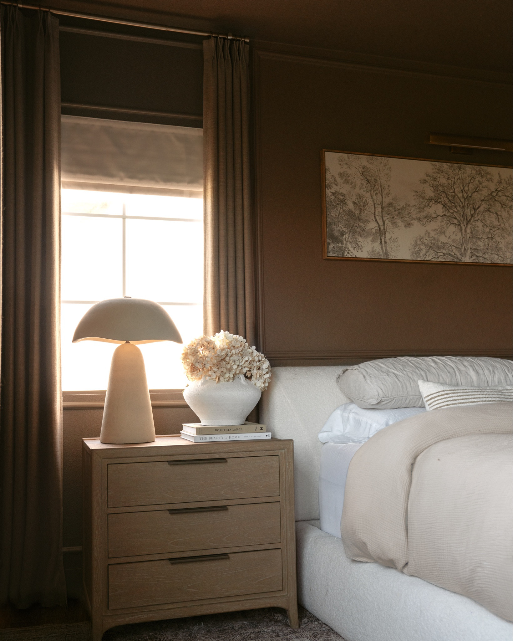 Our bedroom finally feels complete.
 We added custom motorized blackout shades and pleated linen drapes from @twopagescurtains and it changed everything. The space feels softer, more tailored, and honestly… way more peaceful.

Each shade is remote controlled, so we can open and close them all with a single click. No more tangled cords or early morning light!

SHADE DETAILS:
Motorized Cordless Roman Shade | Isabella Seedpearl | Blackout Liner

CURTAIN DETAILS:
Liz Linen Drape Pleated | Oak Dim Gray | Memory Shaped Pinch Pleat

PAINT COLOR:
Northwood Brown by Benjamin Moore 
. . . #casachicollo #twopagescurtains #blackoutshades #customdrapes #bedroomdetails #softminimalism #modernorganic #neutralinteriors #interiordecor #bedroomrefresh #twopageshome #cozycorners #californiacasual #designinspo